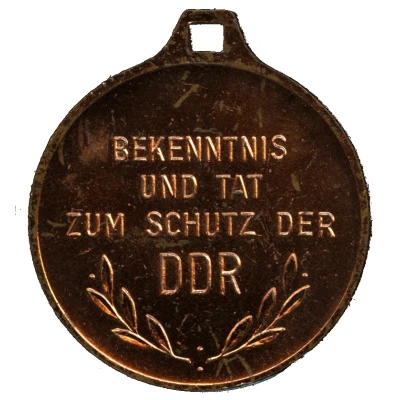 Medal - Bekenntnis und Tat zum Schutz der DDR ND back